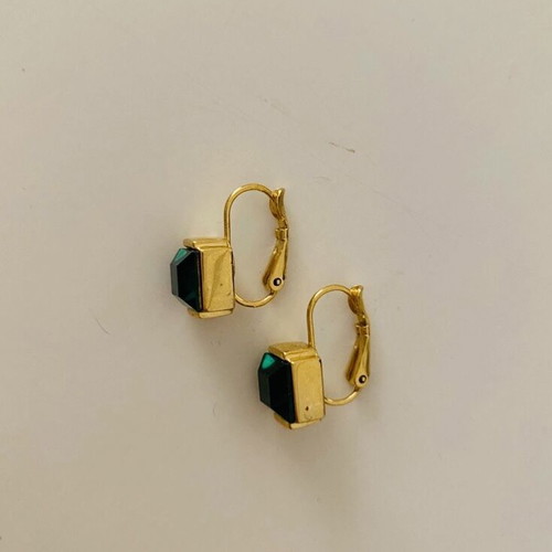 Earrings used, yellow color with green stone