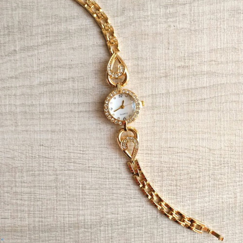 Quartz women's elegant gold wristwatch with zircon used