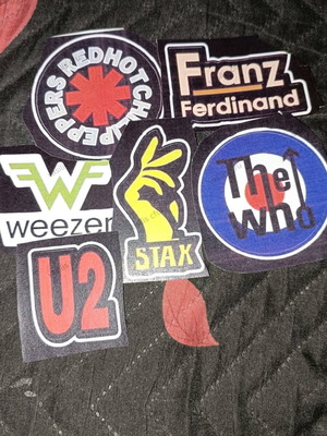 Paper logos from music bands used, not stickers