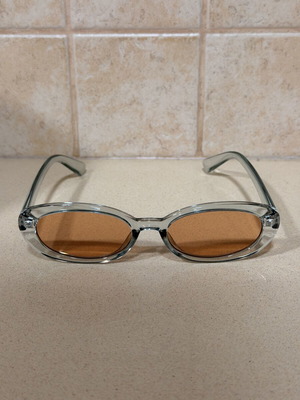 CHPO sunglasses, transparent grey frame with brown lenses, oval retro