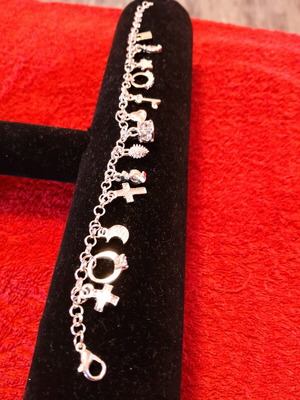 Women's bracelet new with variety of silver charms