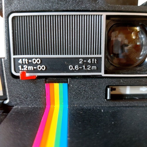 Polaroid Supercolor 635CL vintage instant camera used with strap