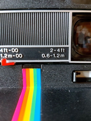 Polaroid Supercolor 635CL vintage instant camera used with strap