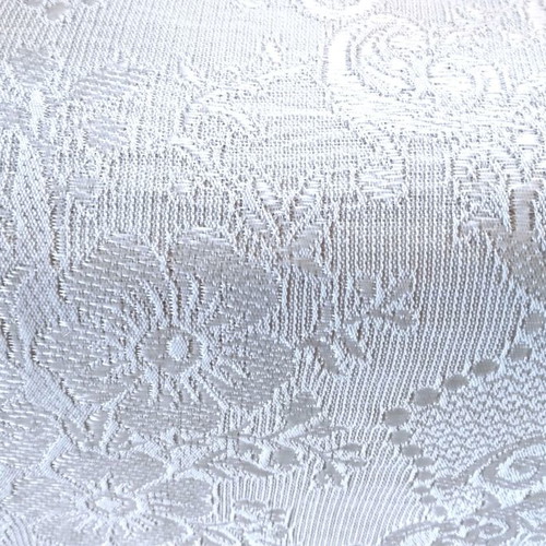 Woven quilt or throw with floral motifs, white