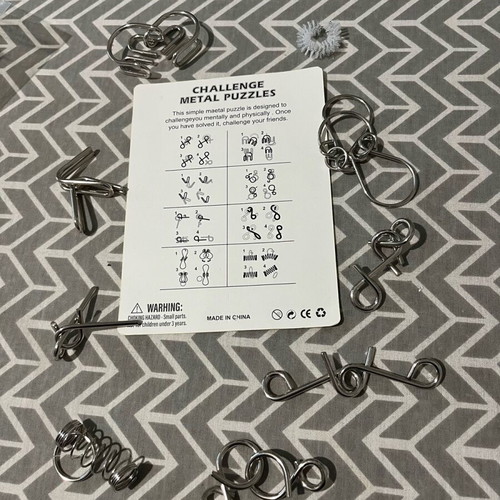 Challenge metal puzzles board game like new