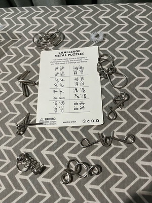 Challenge metal puzzles board game like new