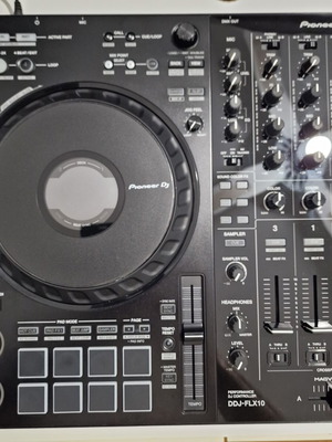 Pioneer DDJ-FLX10 DJ controller used with soft case and music collection