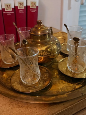 Bronze tea set like new with teapot, glasses, saucers, spoons
