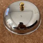 Metal serving bowl with gold handles