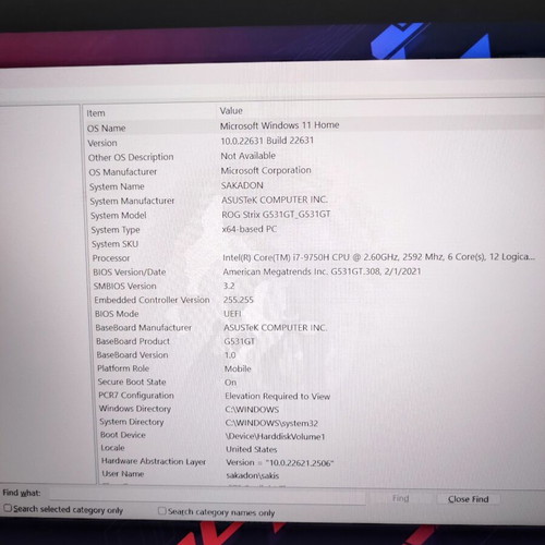 ASUS ROG Strix G531GT gaming laptop with headphones and keyboard