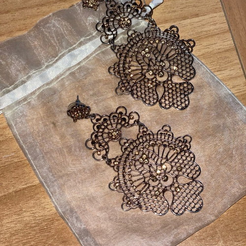 Long gold-plated earrings used with bronze-tone rhinestones