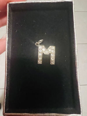 Letter M pendant with rhinestones, silver color