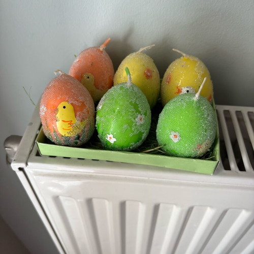 Easter candles shaped like eggs like new, painted