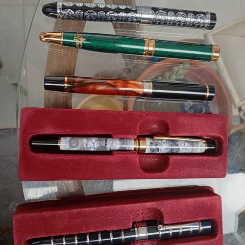 Pens in like-new condition with various designs