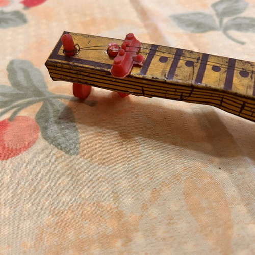 Greek Panigyriotiko tin toy banjo with monkey lithograph