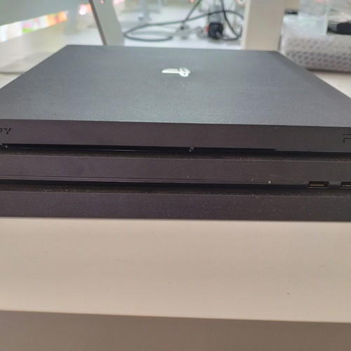 PlayStation 4 Pro with compatible controller like new
