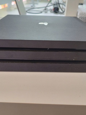 PlayStation 4 Pro with compatible controller like new