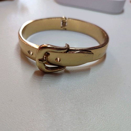 Handcuff bracelet in yellow color like new