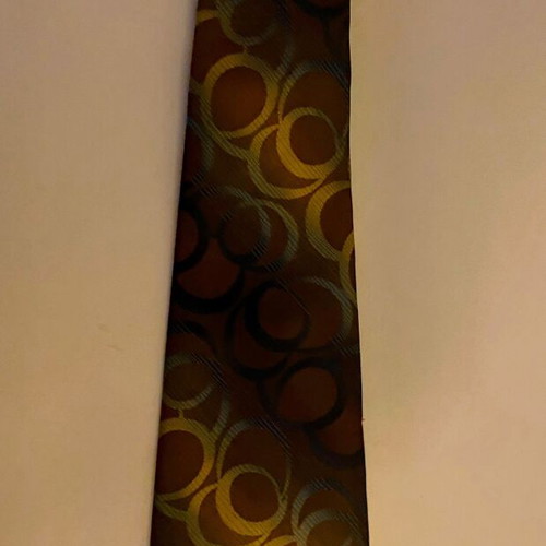 Vintage Trevira tie with geometric pattern in brown and gold, like new