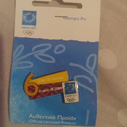 Olympic pin Athens 2004 like new with 6th day of games leaflet