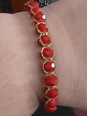 Handmade macrame bracelet with red stones and gold thread like new