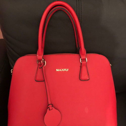 Red handbag used with wear marks