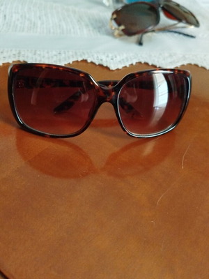 Brown sunglasses used with brown-white lens