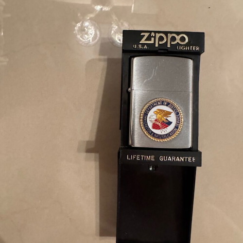 Zippo collectible lighter new with Department of Justice DOJ FBI case