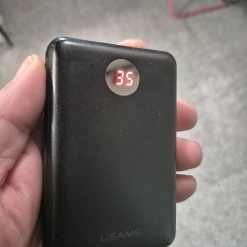USAMS Power Bank 10,000mAh used with digital display and built-in cables