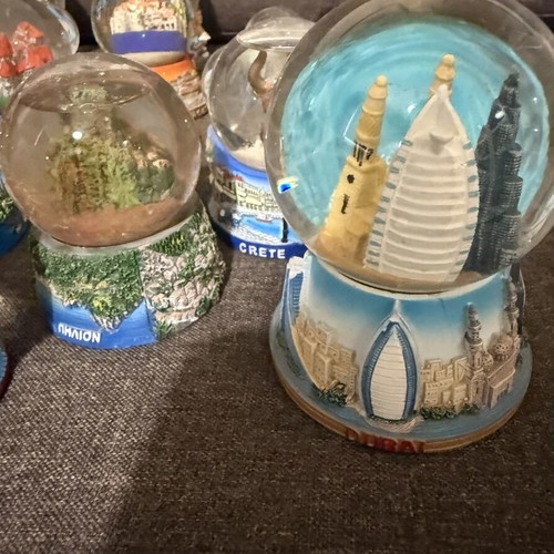 Tourist souvenir snow globes new from various world and Greek locations