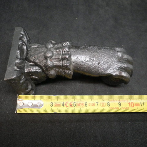 Antique iron door knocker used, made of cast iron