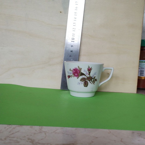 Vintage porcelain cup with roses and angled handle like new