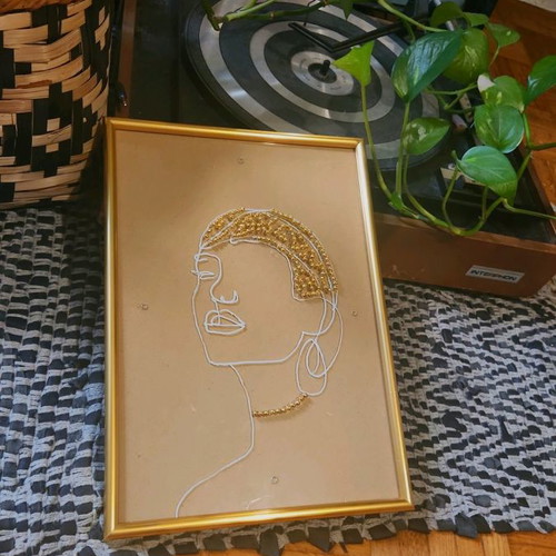Handmade frame new with female face and golden beads