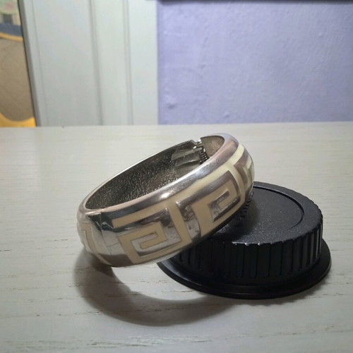 Women's silver handcuff bracelet like new with white pattern