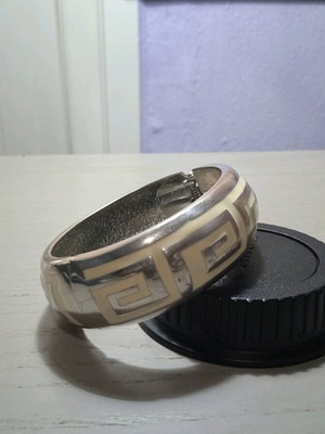 Women's silver handcuff bracelet like new with white pattern