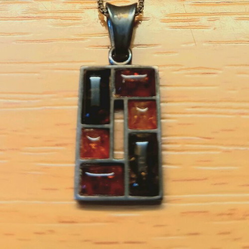 Silver pendant with Baltic amber like new