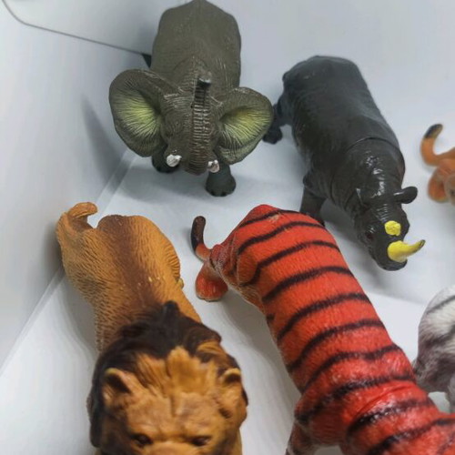 Plastic jungle animals and small dinosaurs used