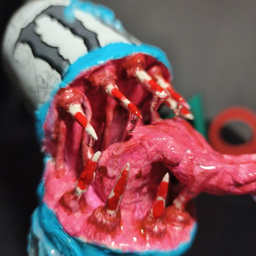Handmade monster figure from Monster can with clay and UV resin