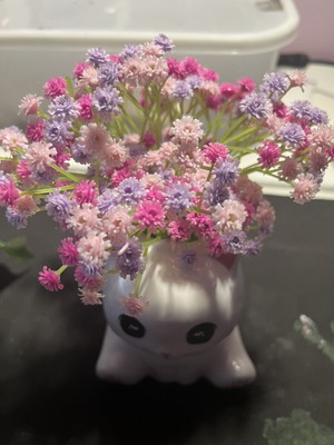Decorative clay cat with flowers