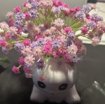 Decorative clay cat with flowers