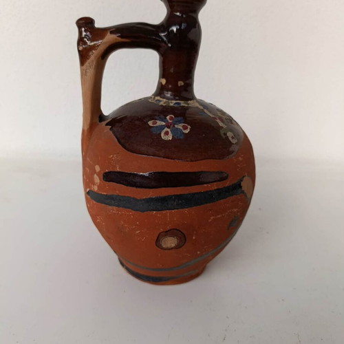 Clay jug with handmade painting used