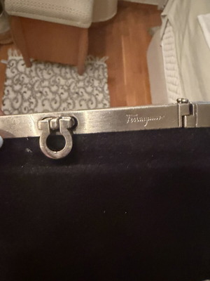 Salvatore Ferragamo black velvet clutch with silver metal frame