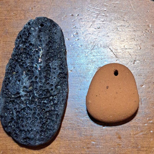 Natural raw stones like new, oval terracotta and textured gray