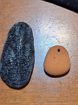 Natural raw stones like new, oval terracotta and textured gray