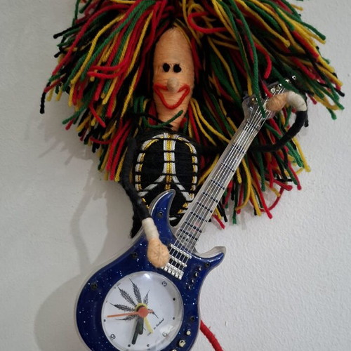 Vintage Table Clock Rastaman Figurine with Guitar like new