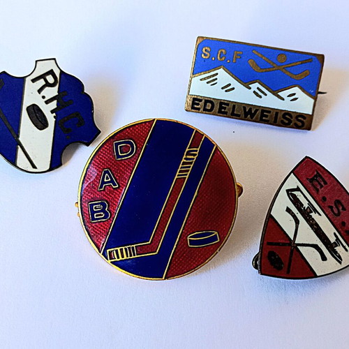 Set of vintage sports enamel pins with hockey theme, used
