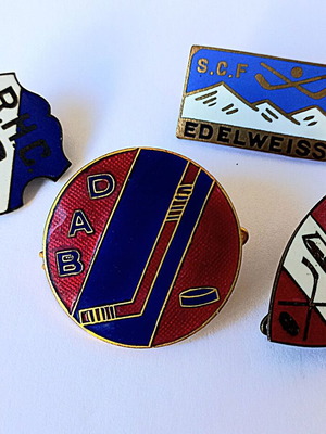 Set of vintage sports enamel pins with hockey theme, used