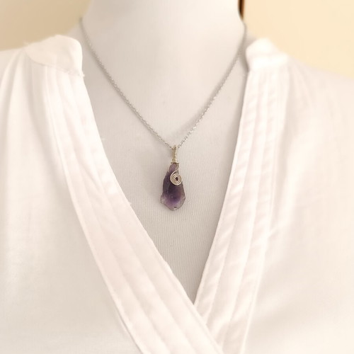 Amethyst wire-wrapped pendant on steel chain