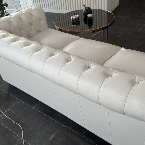 Leather three-seater sofa