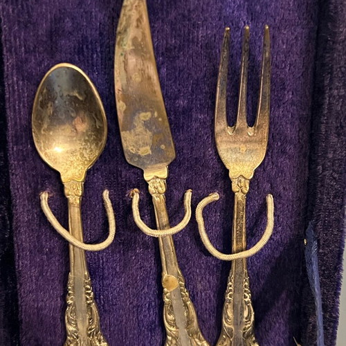 Antique silver-plated cutlery set used, knife fork and spoon in velvet box